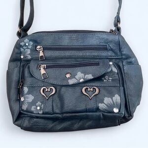Stylish Blue Handbag with Floral Accents